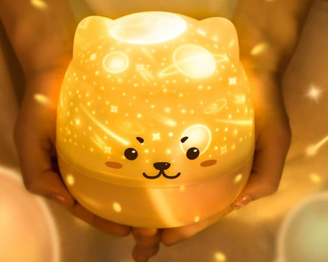 Natlampe projektor med stjerner og musik