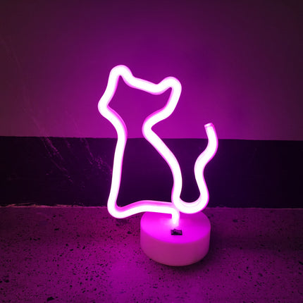 Lyserød neon lampe formet som kat