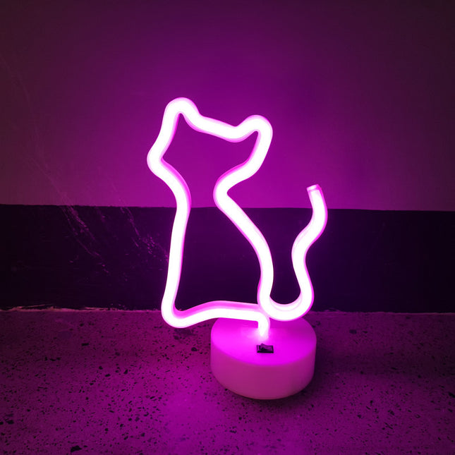 Lyserød neon lampe formet som kat
