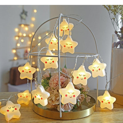 Dekorativ lyskæde med hvide stjerner