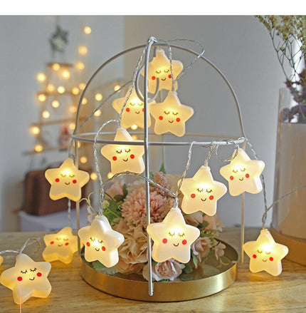 Dekorativ lyskæde med hvide stjerner