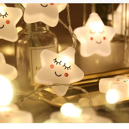 Dekorativ lyskæde med hvide stjerner