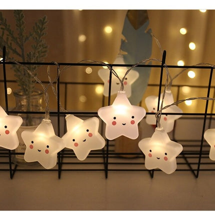 Hvid lyskæde med smilende stjerner